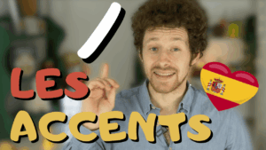 Miniature de vidéo avec le titre « les accents écrits », un accent aigu dessiné et une photo de Pierre en arrière-plan, illustrant un article Holamigo